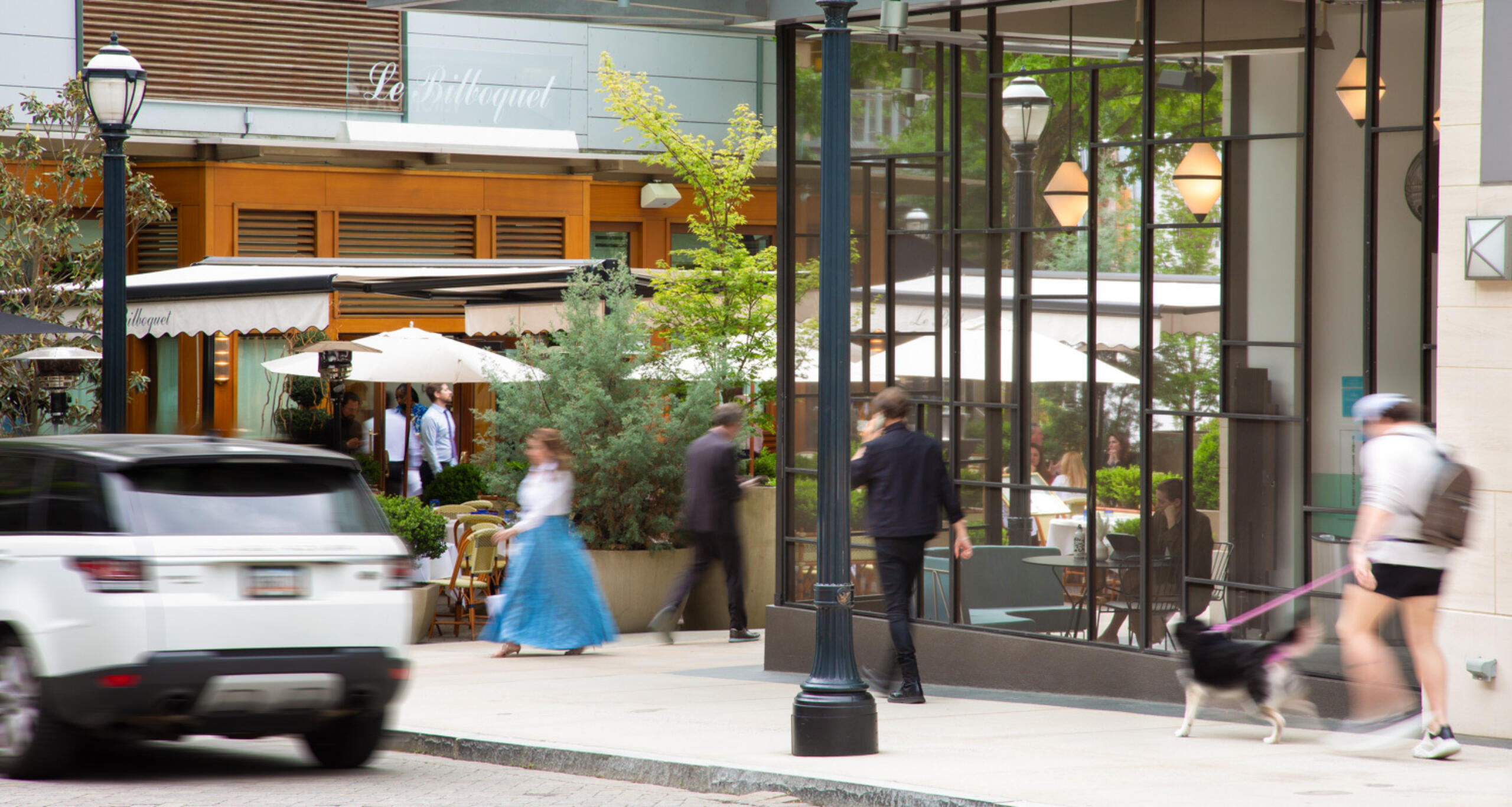 Visitors walking on a sidewalk at Buckhead Village District