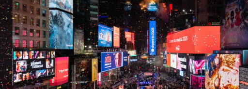 Massive crowd in Times Square for New Year's Eve 2025 celebration with Ball Drop and fireworks atop the One Times Square building