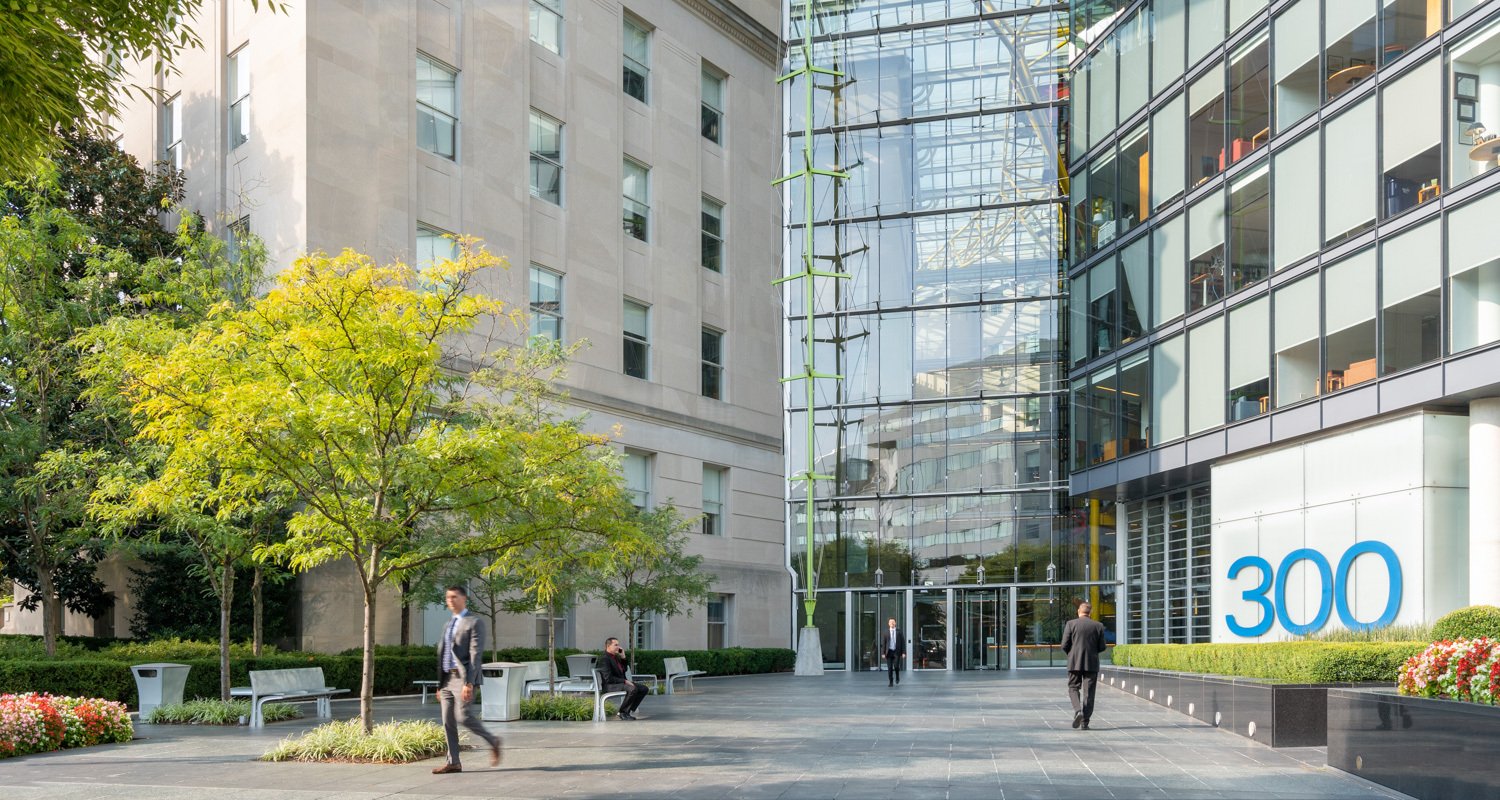 America's Square's exterior façade with people walking in courtyard