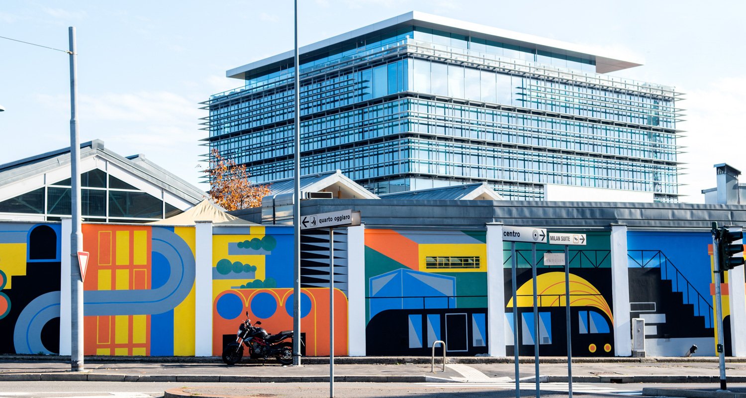 Certosa District exterior with colorful mural and midrise building facade